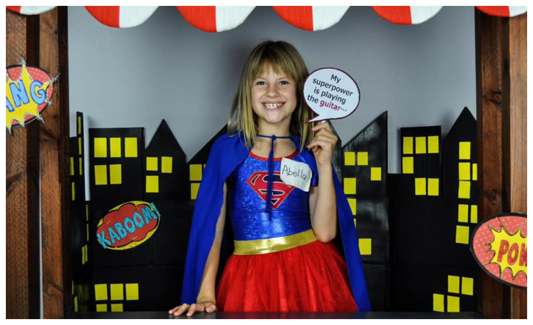 Abella playing guitar